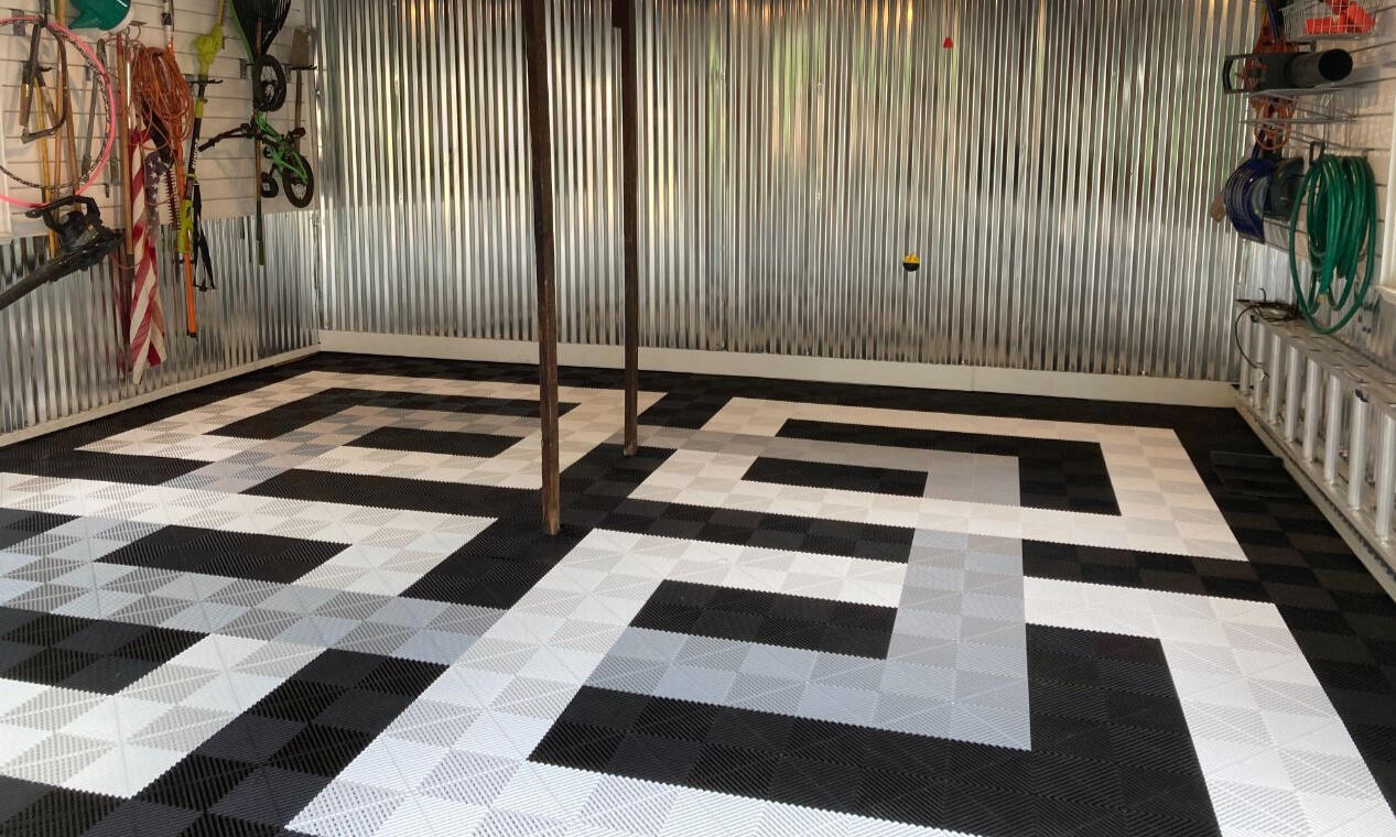 Black, gray and white Swisstrax garage floor square overlapping design