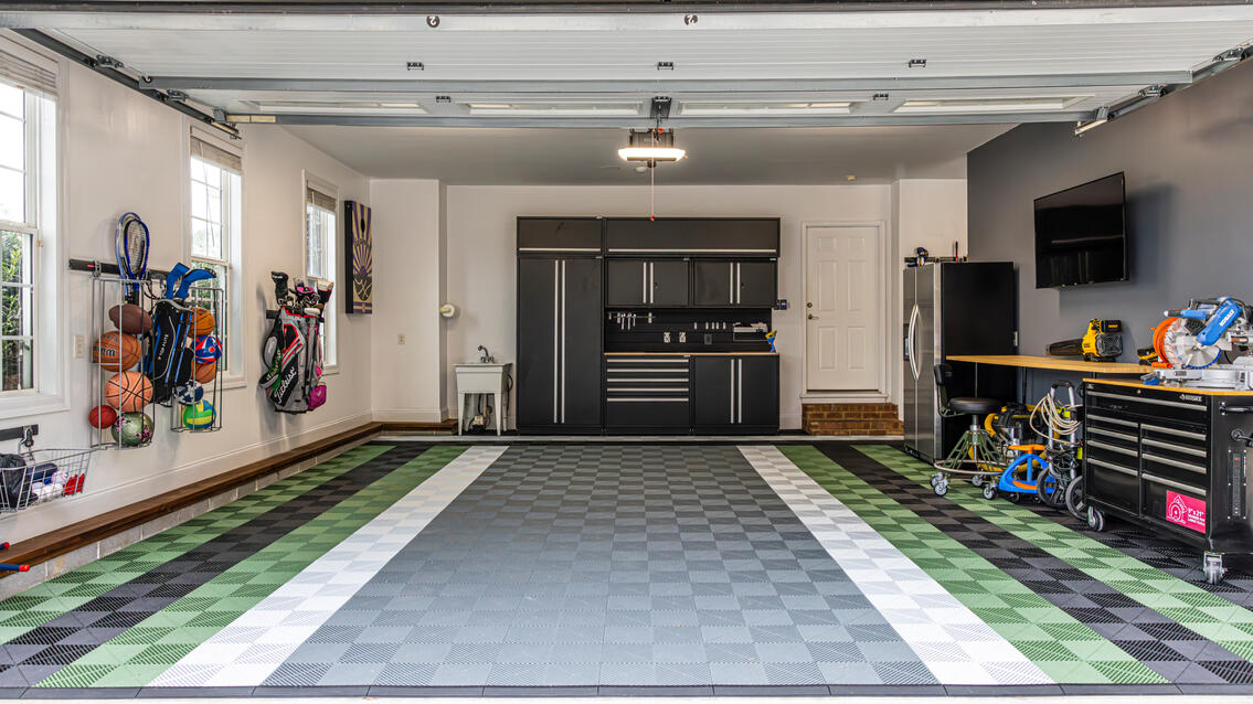 Black, gray, white and green Swisstrax garage floor design