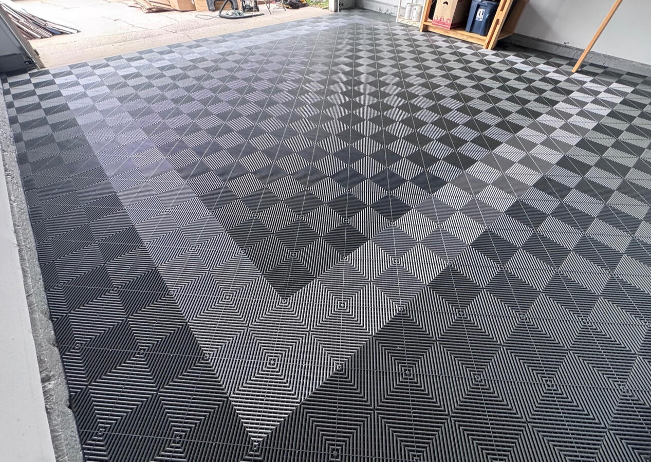 Completed slate gray Swisstrax garage floor from back corner Completed slate gray Swisstrax garage floor from back corner