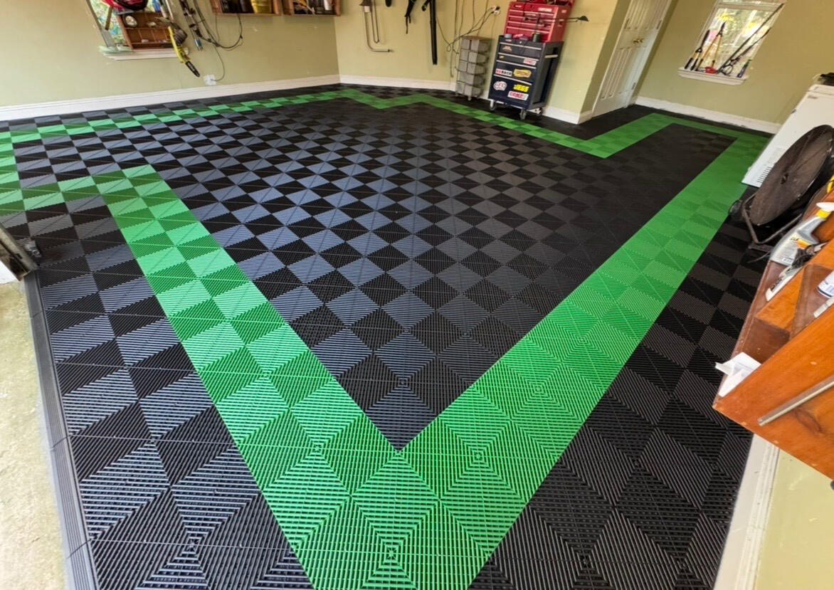 Completed green and black swisstrax garage floor
