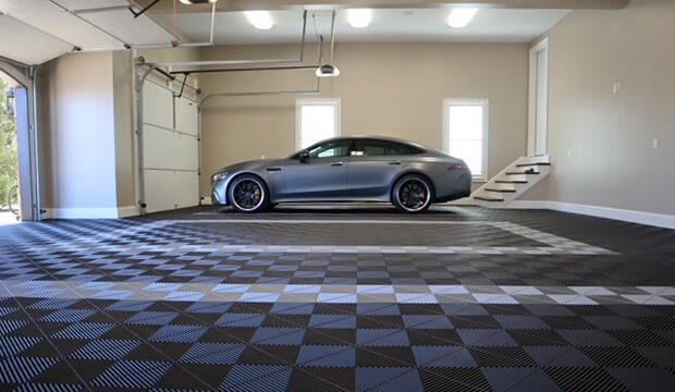 Gray car parked on a blue, black, and gray Swisstrax garage floor